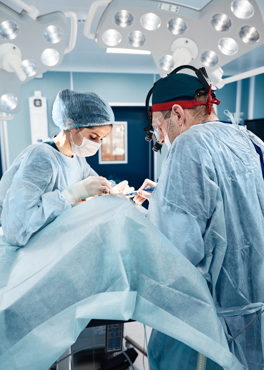 Blepharoplasty, professional surgeons during eye plastic surgery, facial rejuvenation