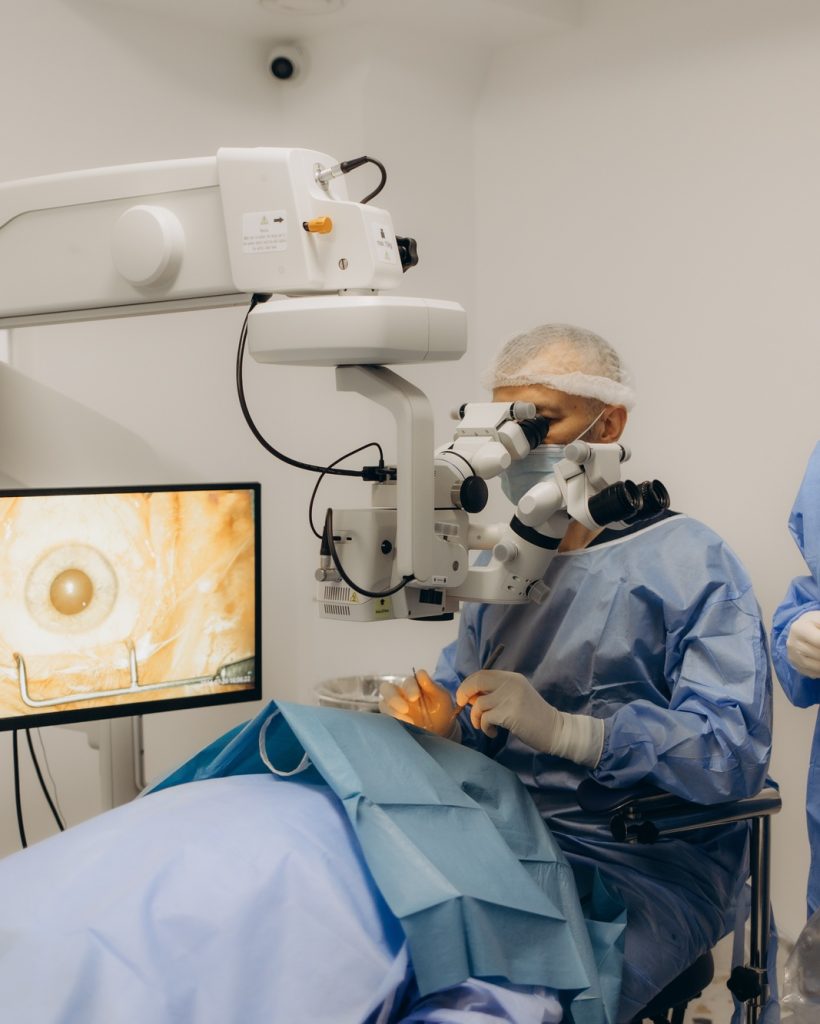 Skilled surgeon and his medical team performs precise eye surgery on an elderly patient, restoring Skilled surgeon and his medical team performs precise eye surgery on an elderly patient, restoring